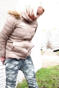 Light-haired Keeps A Lookout As She Pisses Outside