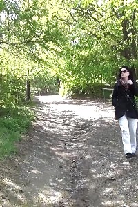 Black Haired Model In Sunglasses Pisses Outside